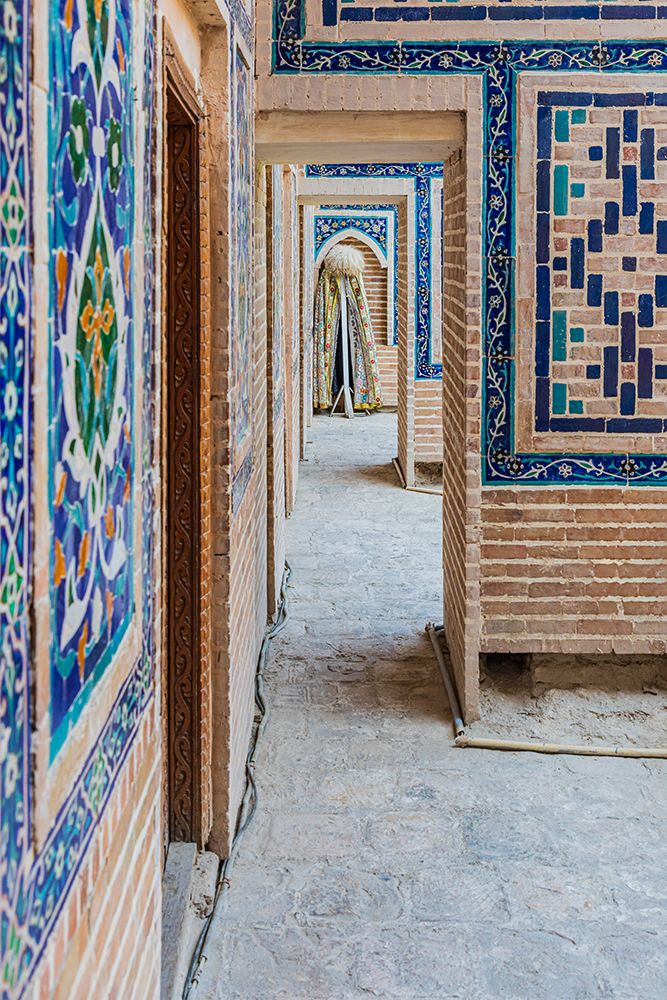 Samarkand, Uzbekistan, Central Asia. Decorative tile on a building in the Registan.